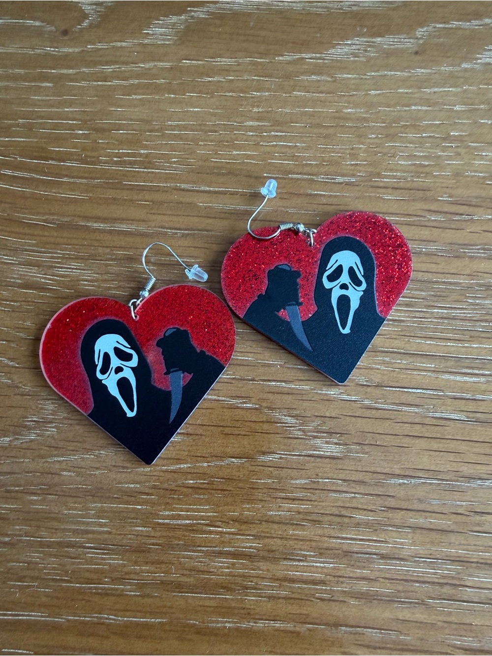 Red Heart Dangle Earrings with Ghost Mask Design